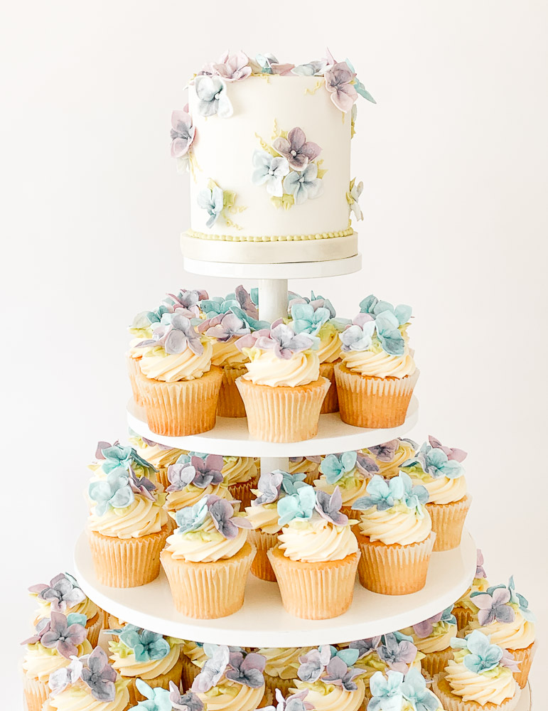 Special Event Vanilla Cupcake Tower with Sugar Hydrangeas Special event cupcake tower with vanilla cupcakes, buttercream, and handmade sugar hydrangeas